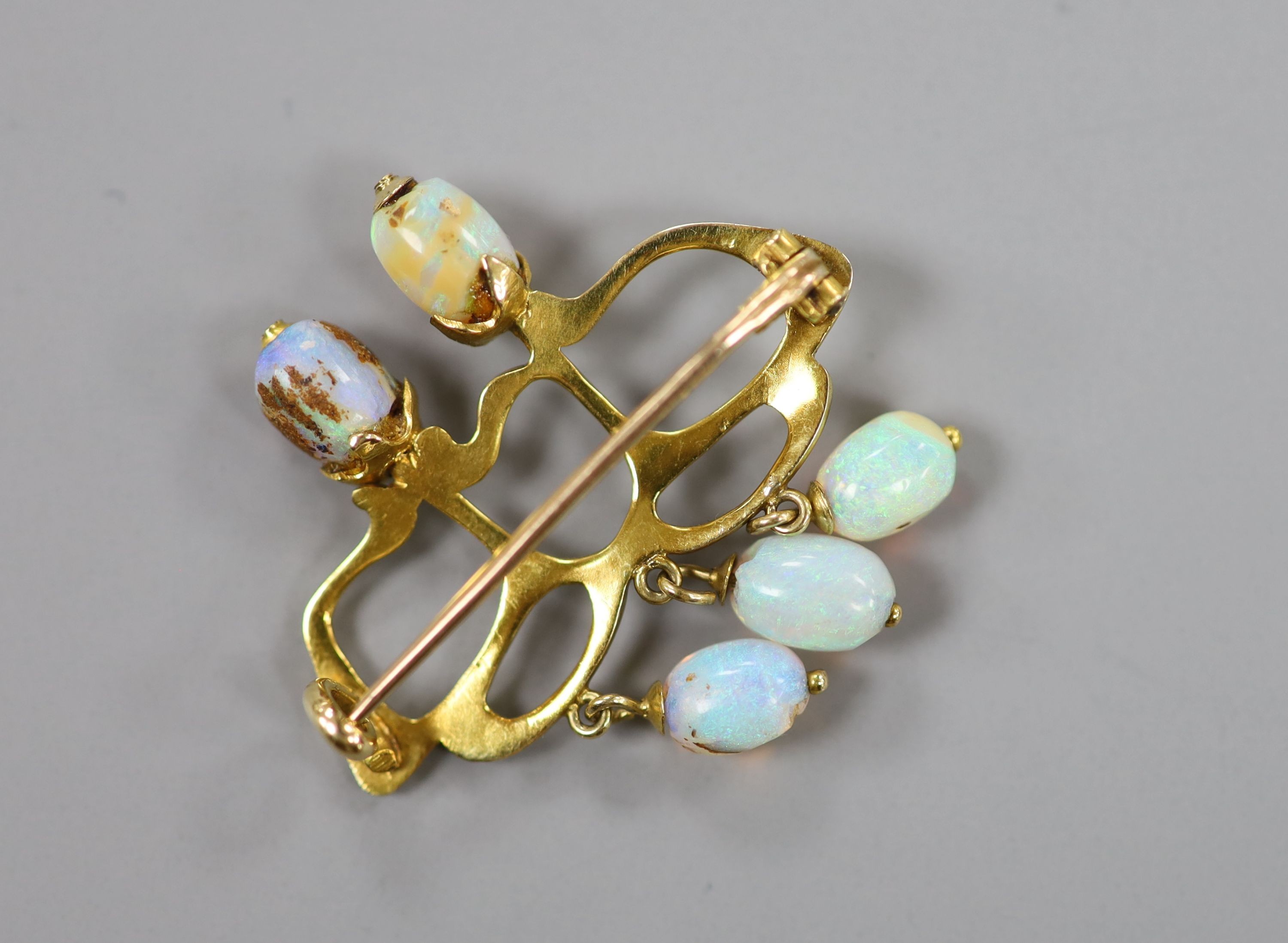 A stylish Art Nouveau yellow metal and five stone opal set brooch(a.f.), 31mm, gross weight 4.8 grams.